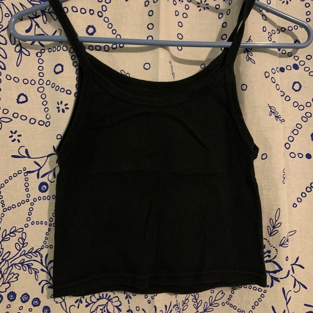 out from under super cute black cropped tank!